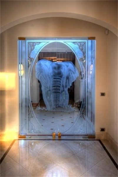 Meertens-Glas-zandtralen-glazen-deur-afbeelding-olifanti-lopend-in-water